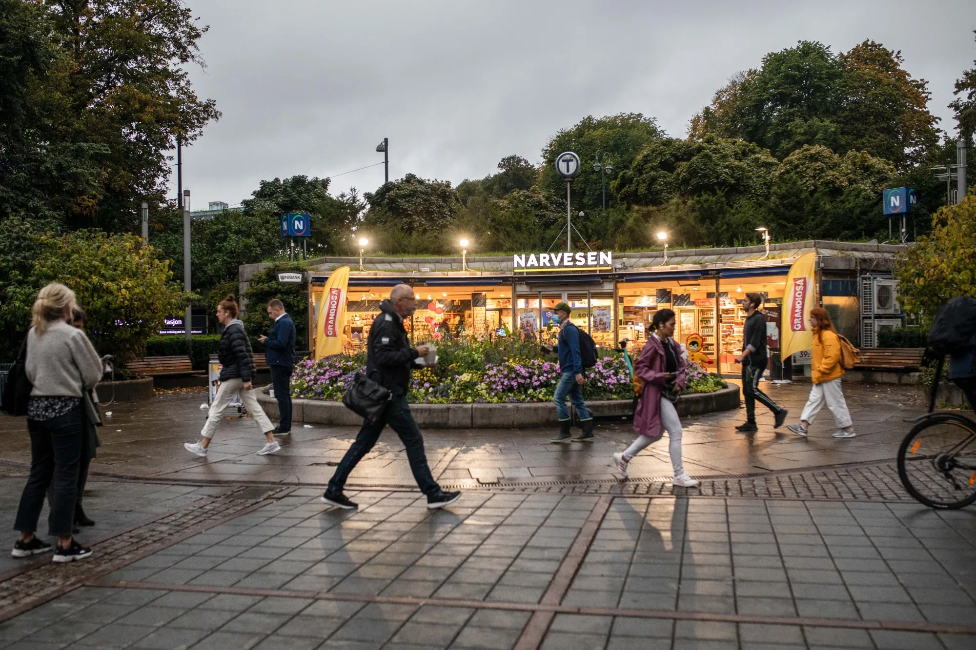 Pedestrians pass a convenience store in Oslo’s theater district.&nbsp;