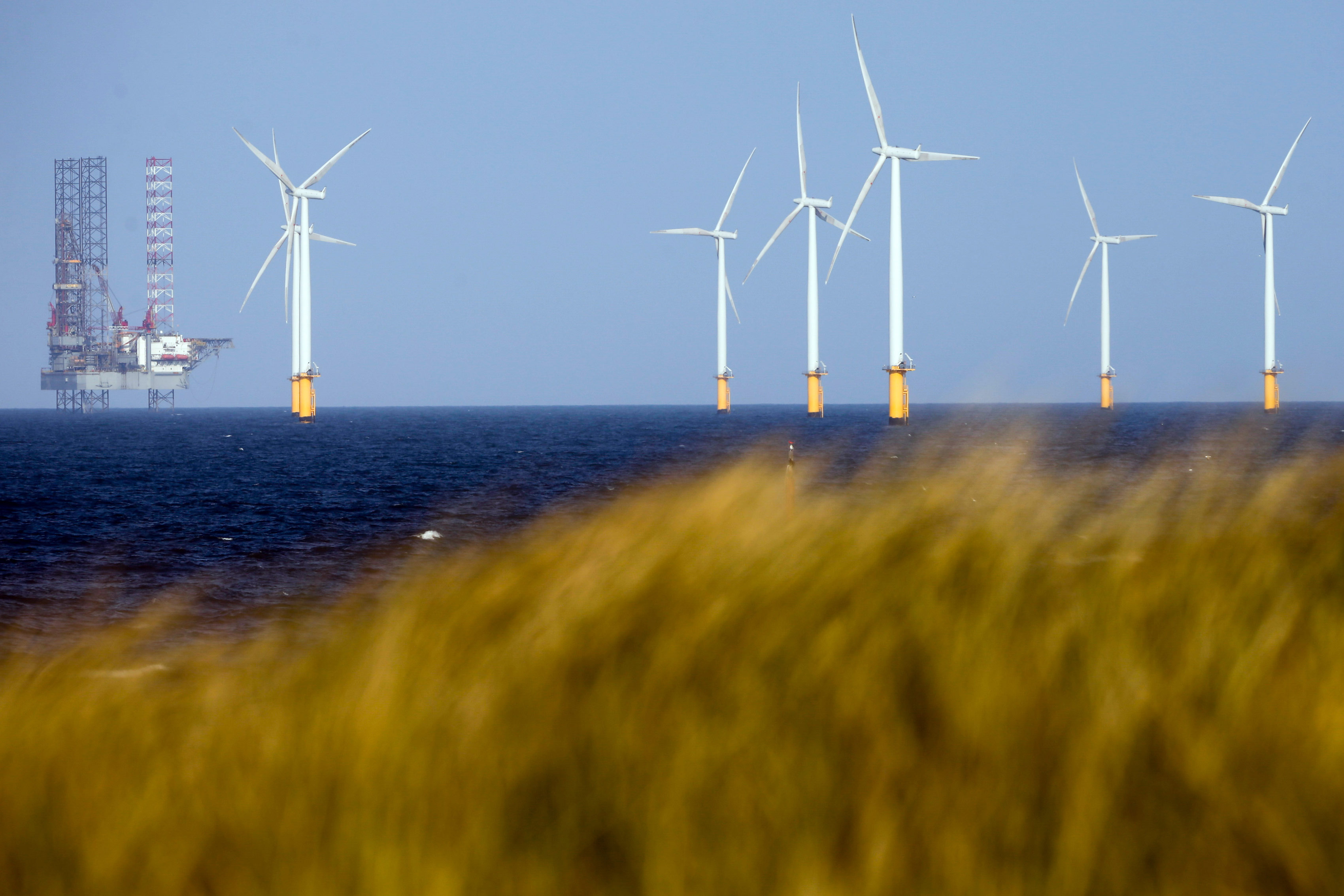 A jack-up rig stands near to Teesside Offshore Wind Farm, operated by EDF Energy Renewables Ltd., in Hartlepool, U.K., on Wednesday, May 3, 2017. The wind farm has a capacity of 62.1 megawatts.
