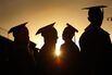 Santa Monica College graduates are silhouetted at sunset as they line up to receive their diplomas