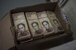 A box filled with 100-bolivar notes is seen at a spare parts business in Los Teques, Venezuela, in&nbsp;2016.