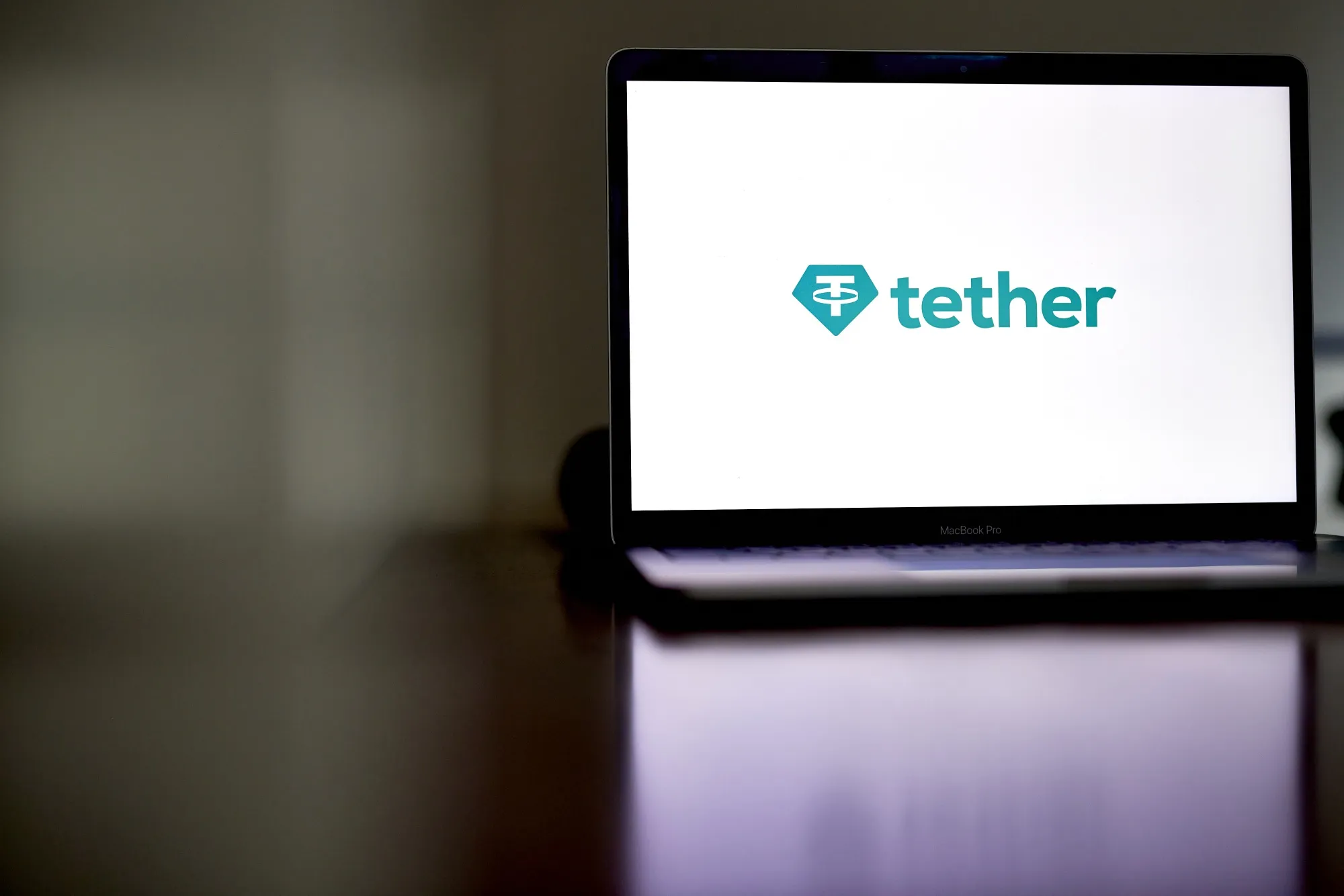 Tether’s stablecoin USDT is pegged to the dollar and backed by Treasuries and other assets.