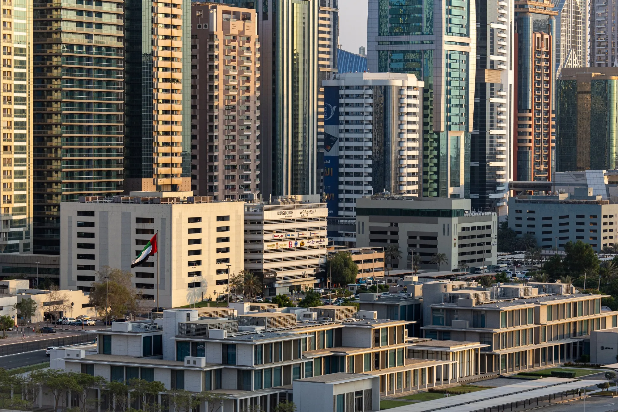 The national flag of the United Arab Emirates flies outside the offices of Meraas Holding in Dubai.
