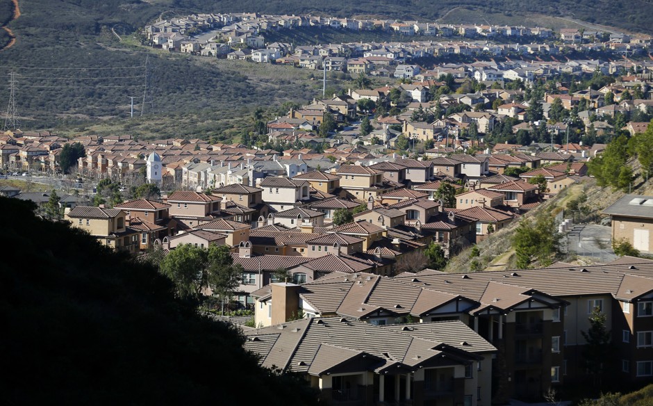 Single-family homes sprawl along a hillside in San Marcos, California.