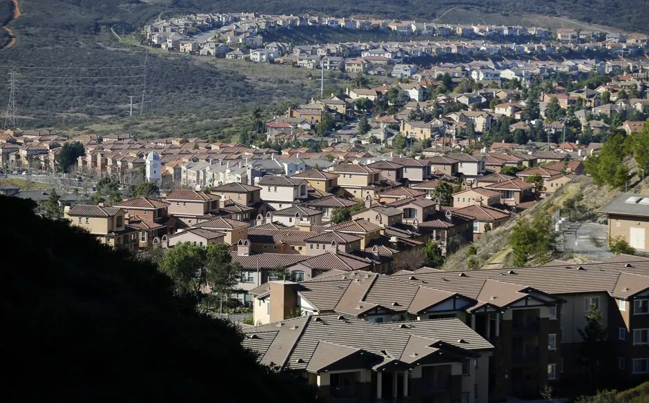 Single-family homes sprawl along a hillside in San Marcos, California.