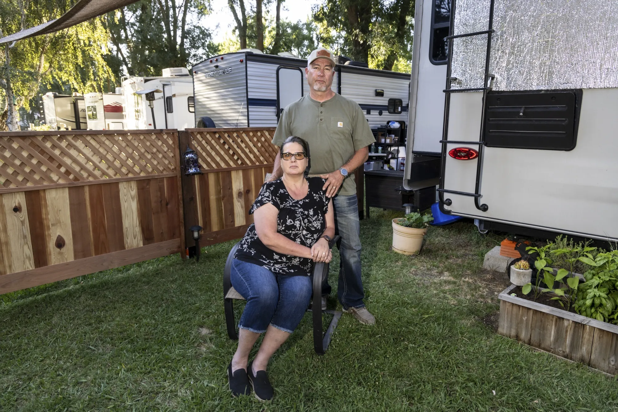 Scott & Kari Amable at their RV site where they live now.