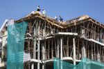Workers labor at a residential construction site in Ho Chi Minh City, Vietnam, on Thursday, Jan. 11, 2018.