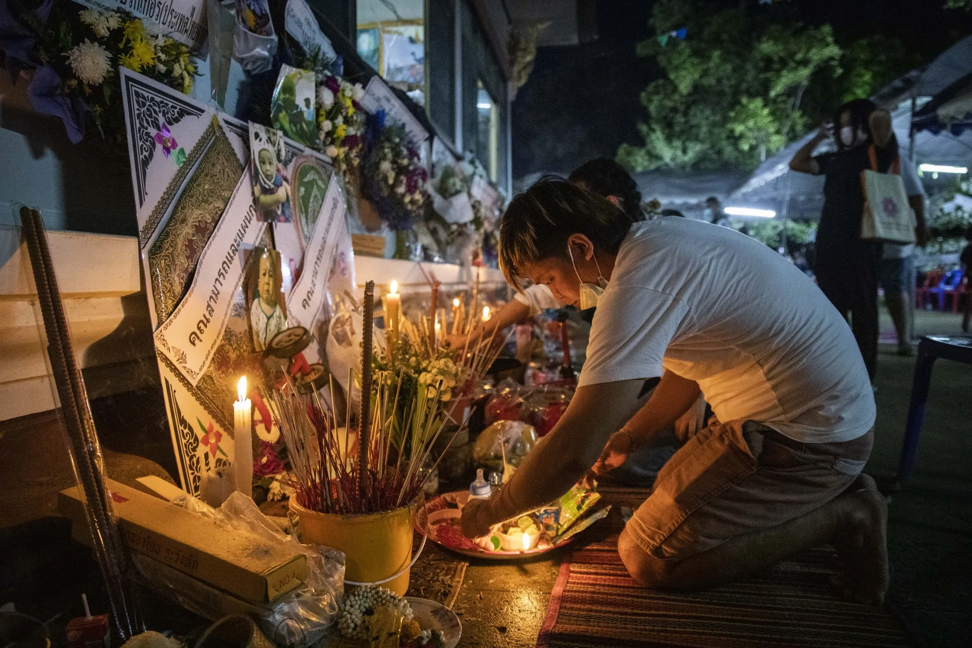 Victims’ relatives gather to pray for their loved ones in Nong Bua Lamphu on Oct. 9.