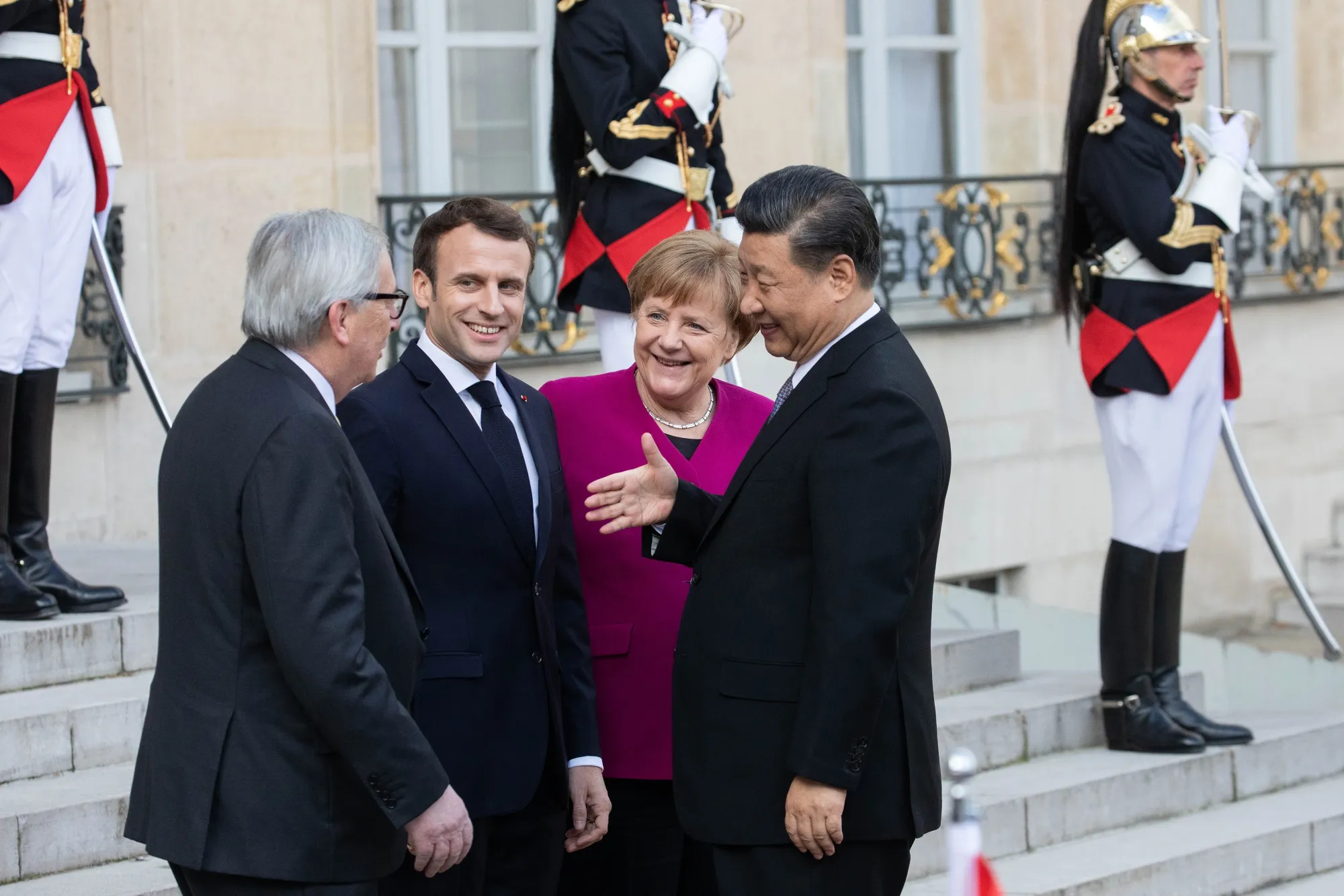Jean-Claude Juncker, Emmanuel Macron, and Angela Merkel&nbsp;greet Xi Jinping&nbsp;in Paris&nbsp;on March 26.