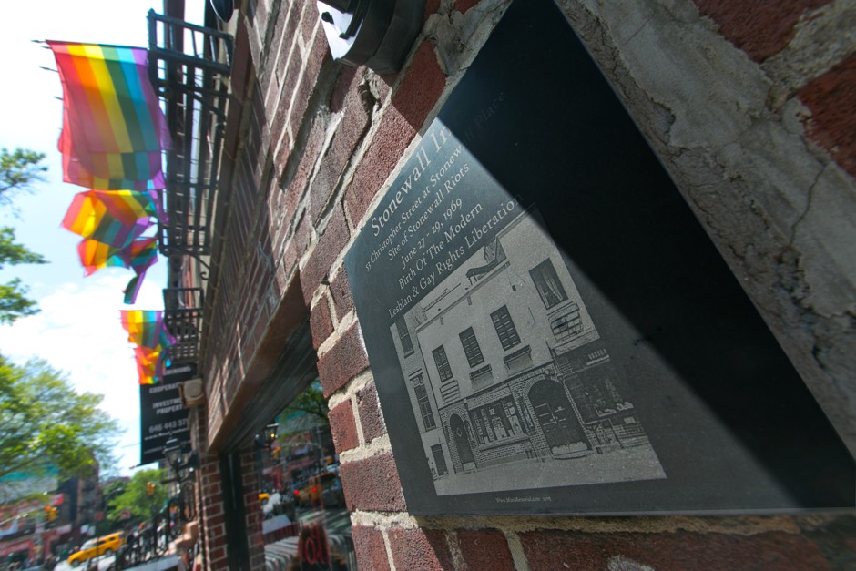 A plaque noting the site of the 1969 Stonewall Riots is affixed to the front of the Stonewall Inn.