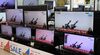 TV screens showing a news program reporting about North Korea's missiles with file images at an electronic shop in Seoul, on March 25. 