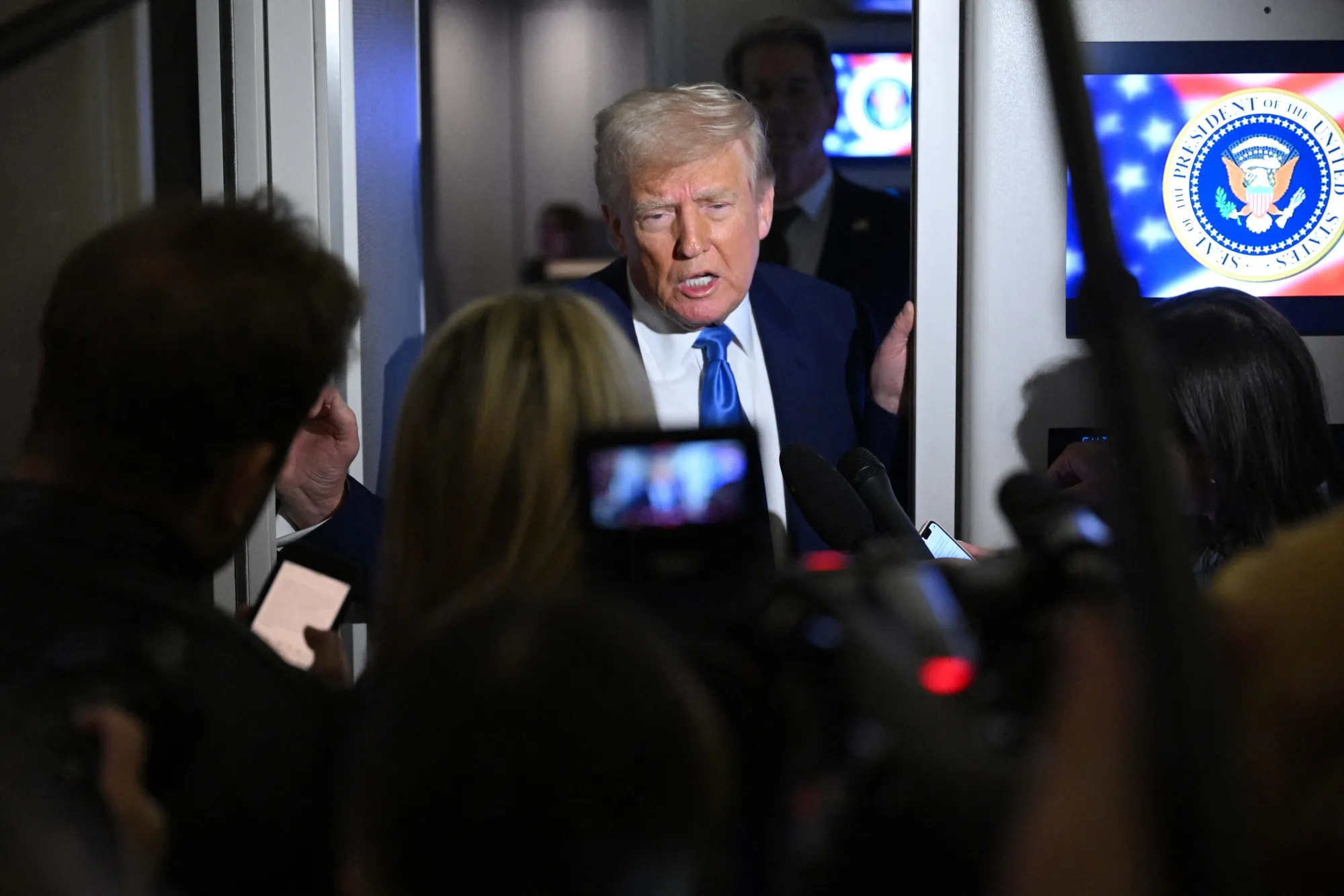 Donald Trump speaks to reporters on Air Force One on April 6.