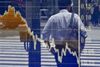 Pedestrians are reflected on an electronics stock indicator at the window of a securities company in Tokyo on June 3, 2019. (Photo by Toshifumi KITAMURA / AFP) (Photo credit should read TOSHIFUMI KITAMURA/AFP/Getty Images)