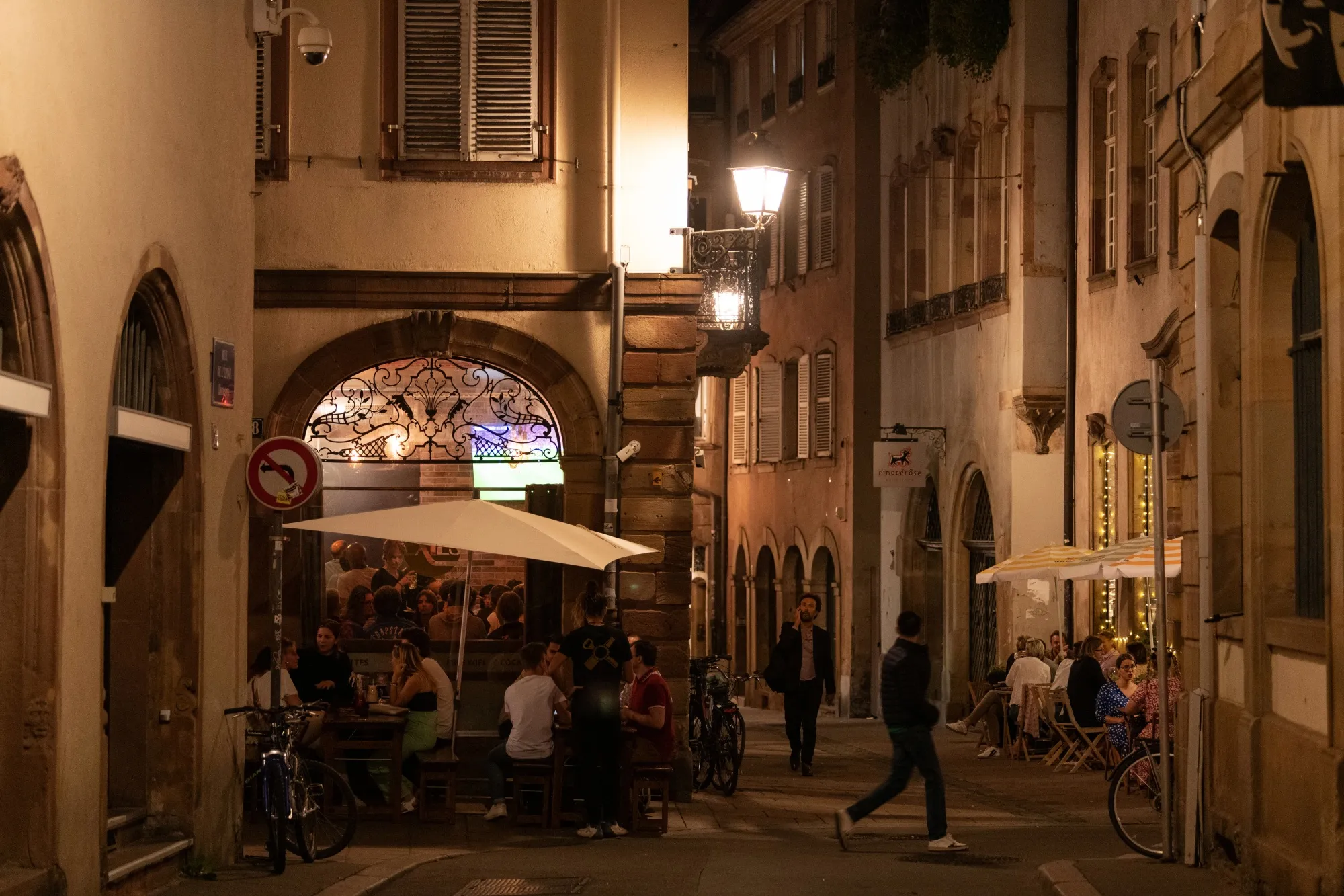 Customers dine at restaurant outdoor terraces at night in Strasbourg, France, on Tuesday, Sept. 13, 2022. The European Commission unveiled an energy intervention plan that it said could raise more than 140 billion euros ($140 billion) for consumers by capping revenues from low-cost producers.