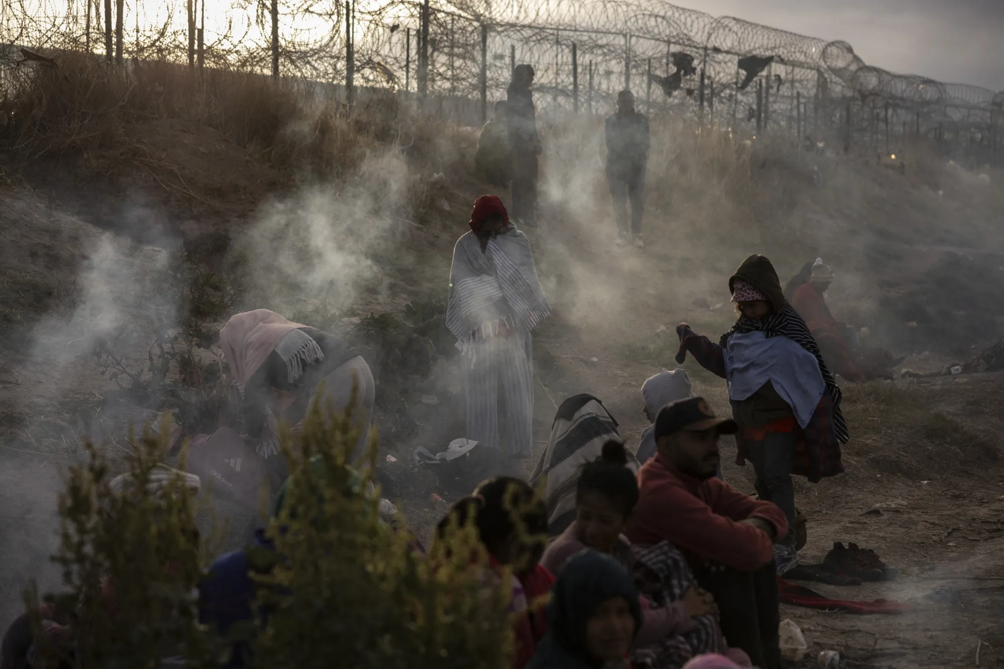 Migrants from Venezuela wait to enter El Paso, Texas, from Ciudad Juarez, Mexico, in 2024.