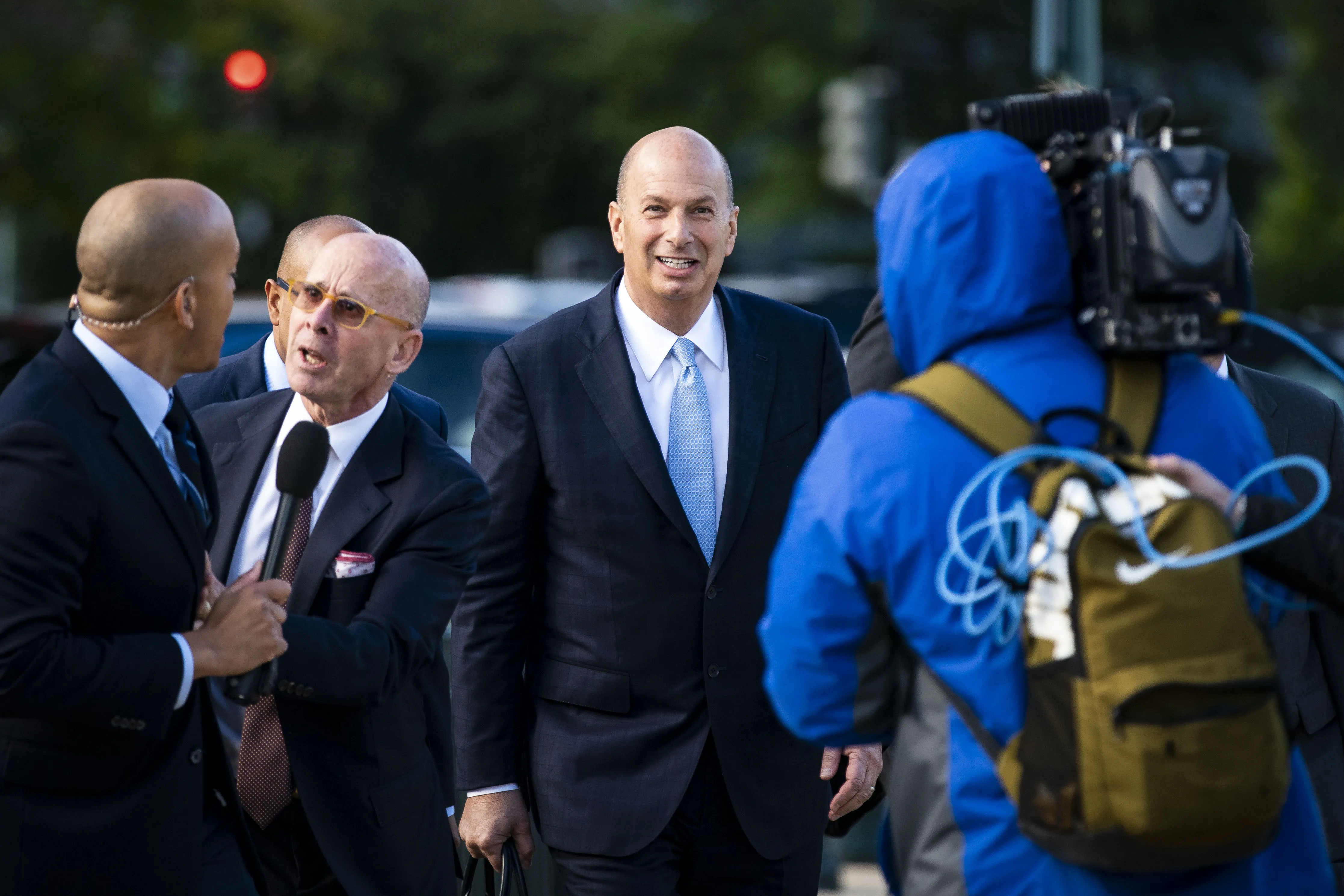 Gordon Sondland, center, arrives for closed-door testimony before House committees on Capitol Hill in Washington on Oct. 17.