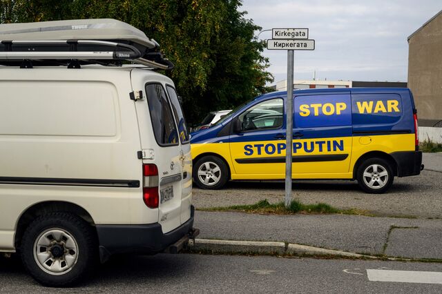 A van protesting Russian aggression in Ukraine is parked next to the church.