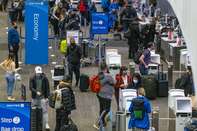 Travelers At SFO Airport As U.S. Holiday Air Travel Surges