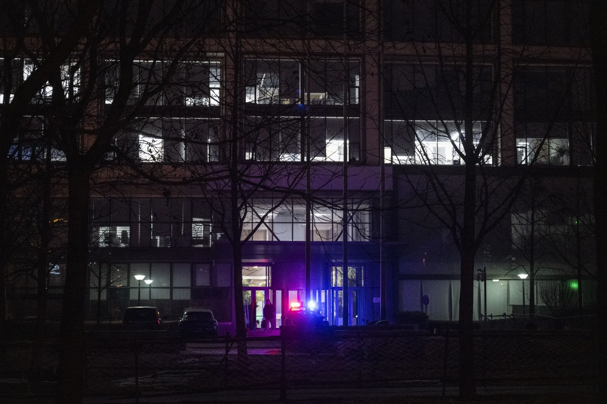 A police car outside the building that houses the headquarters of Zhongzhi Enterprise Group Co. in Beijing on&nbsp;Jan. 5.