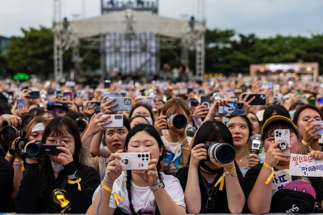 Fans watch South Korean boy band Highlight perform at the Seoul Park Music Festival in June 2023.