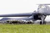 Bombs on trailers near a US Air Force Rockwell B-1B Lancer bomber.