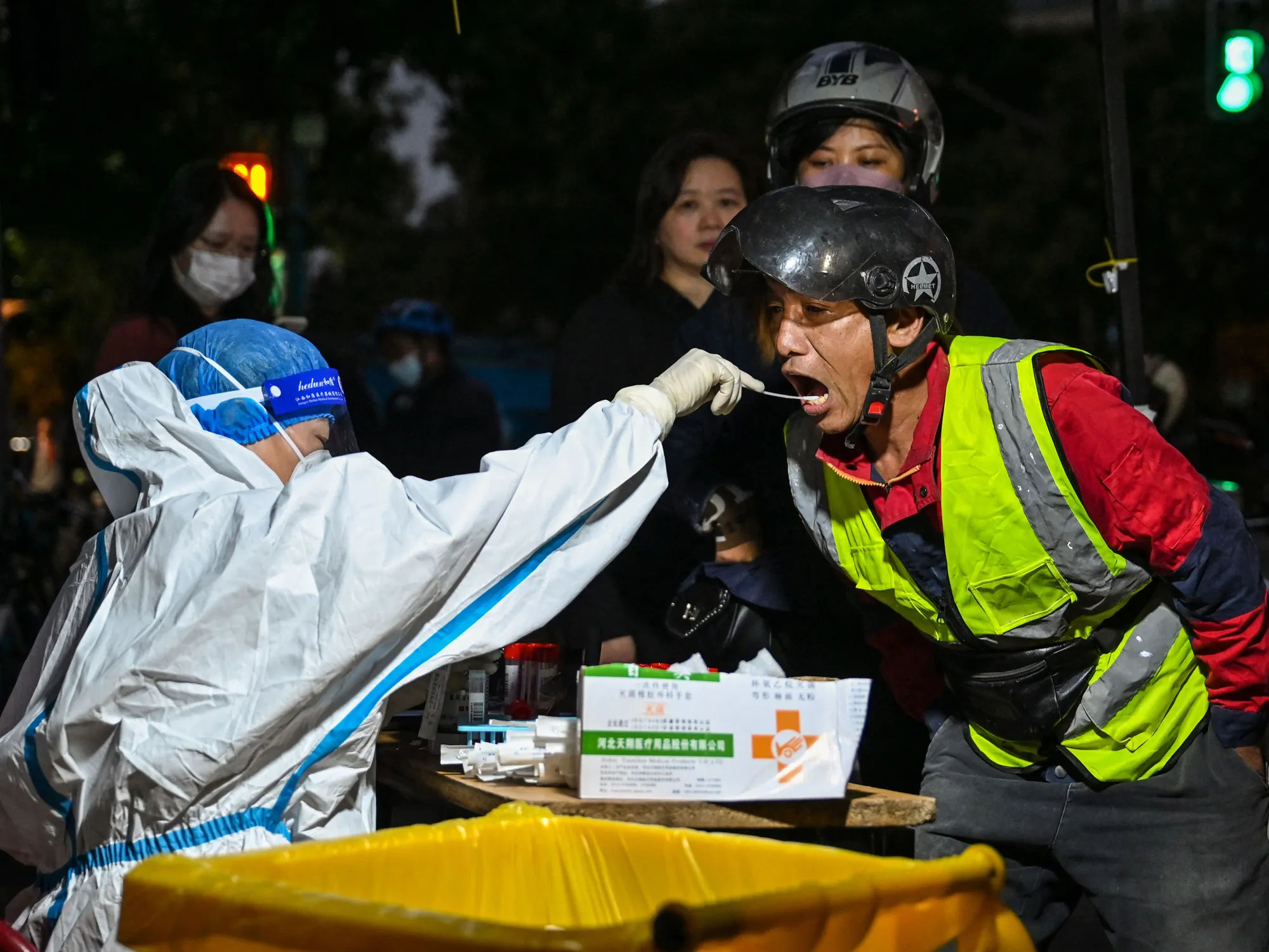 A health worker performs Covid-19 tests in Shanghai, on Oct. 8.