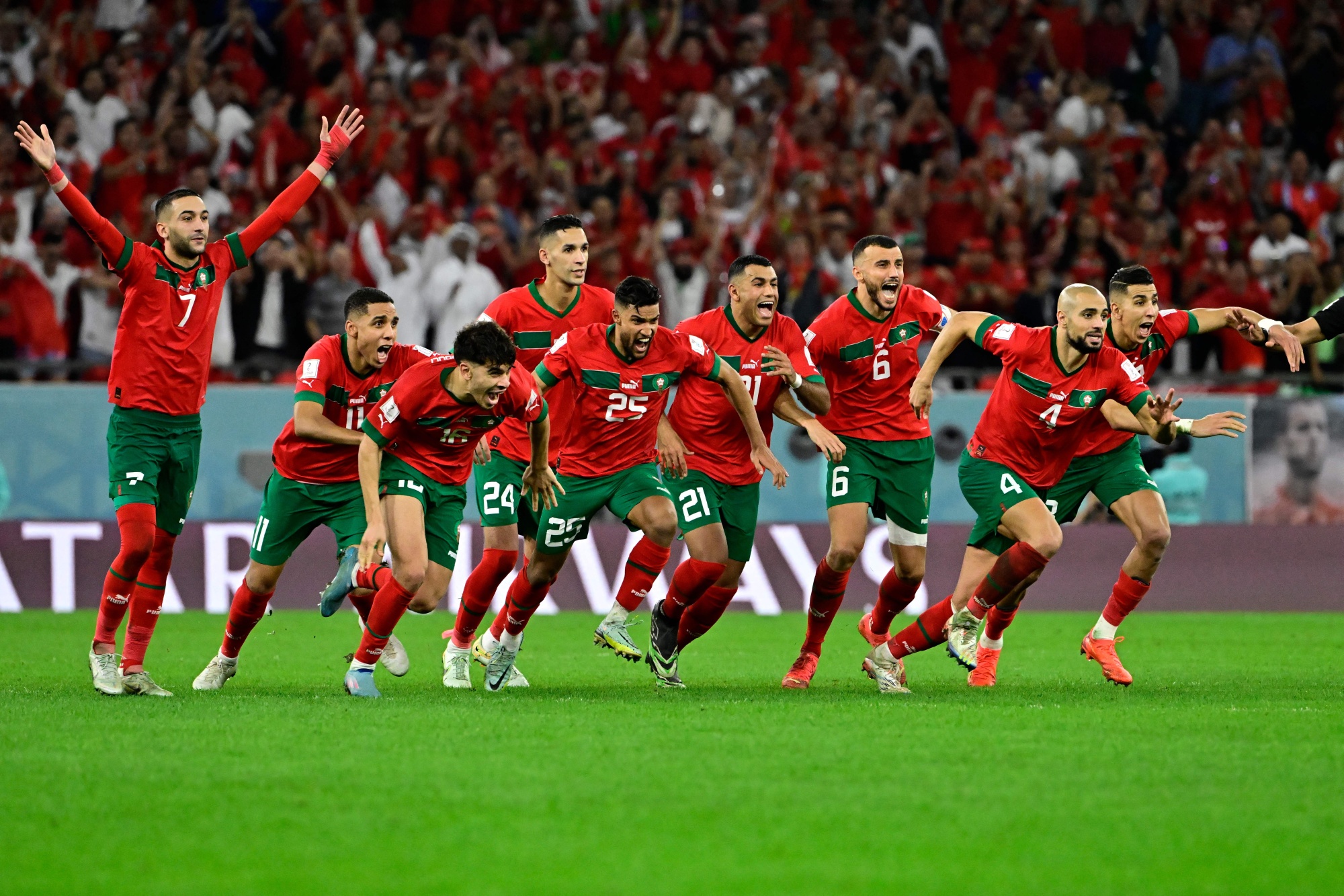 Morocco celebrate winning their FIFA World Cup match against Spain on Dec. 6. Photographer: Javier Soriano/AFP/Getty Images