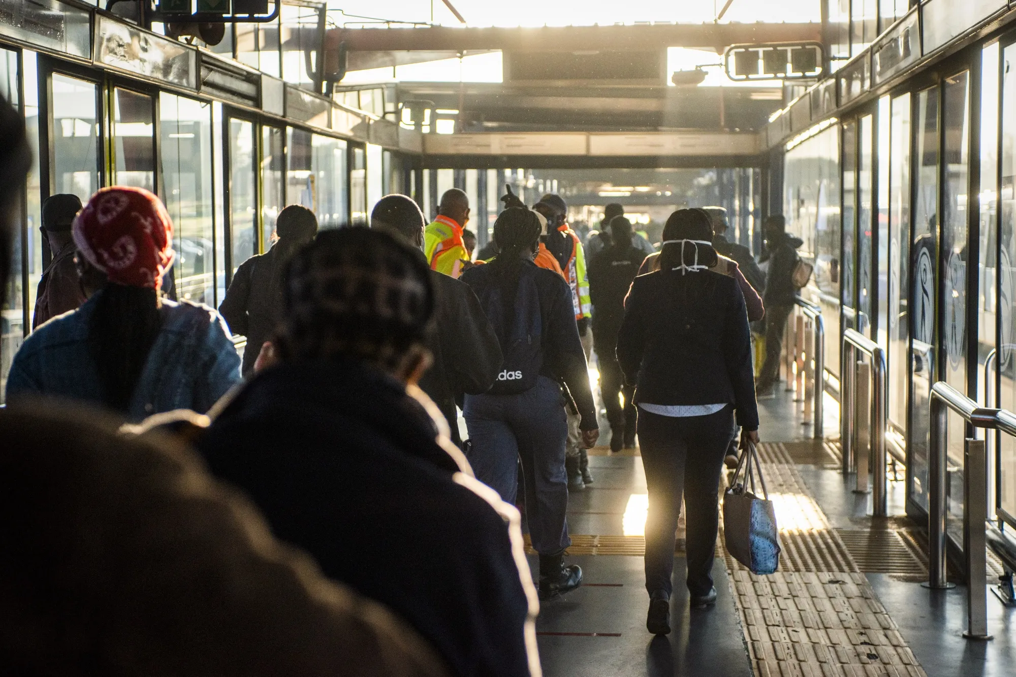 Commuters walk through the Rea-Vaya Thokoza Park bus station in the Soweto district of Johannesburg, on May 14.