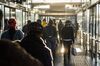 Commuters walk through the Rea-Vaya Thokoza Park bus station in the Soweto district of Johannesburg, on May 14.