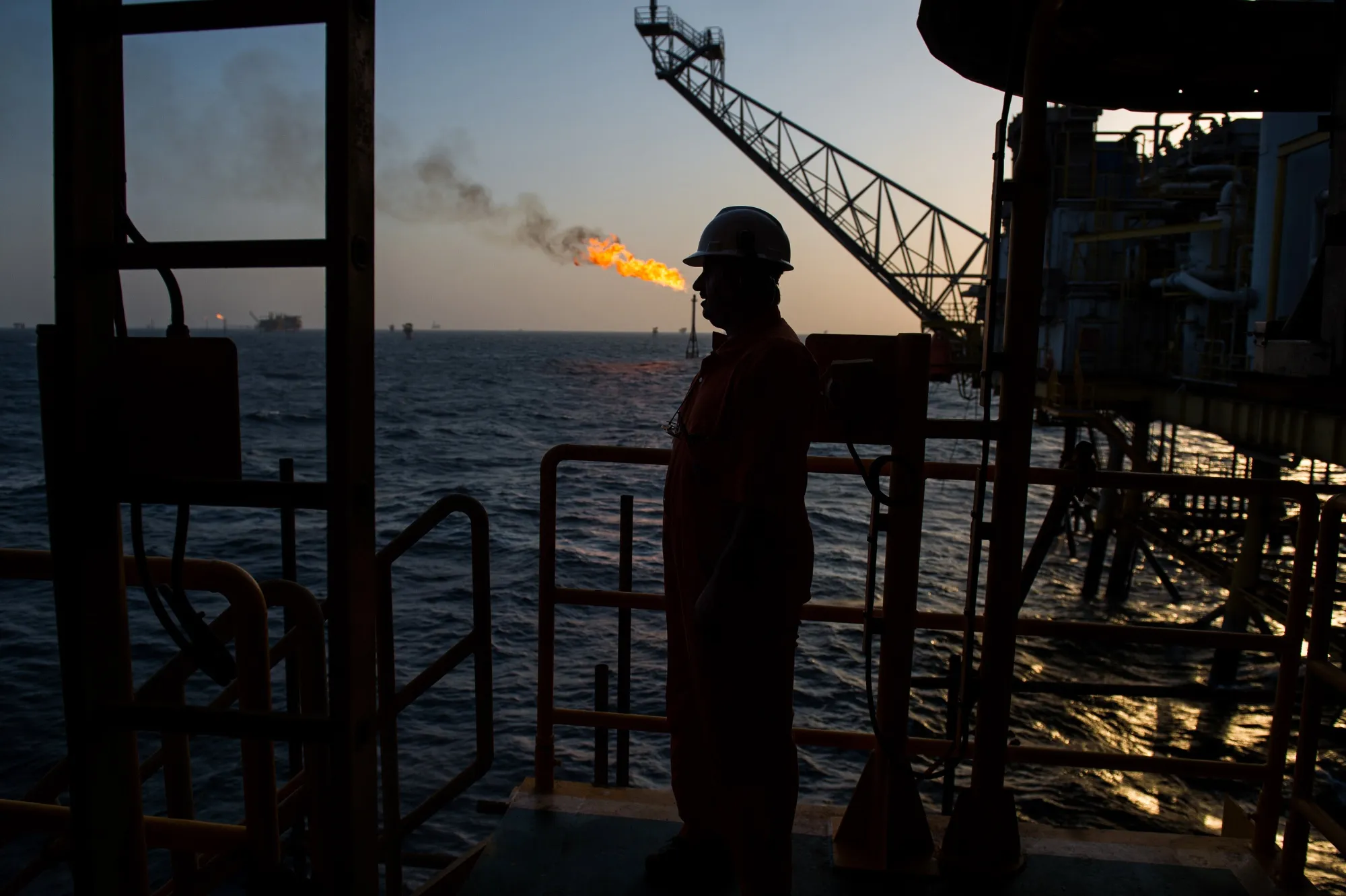 A gas flame burns from a pipe close to an offshore oil platform in the Persian Gulf's Salman Oil Field, near Lavan island, Iran.