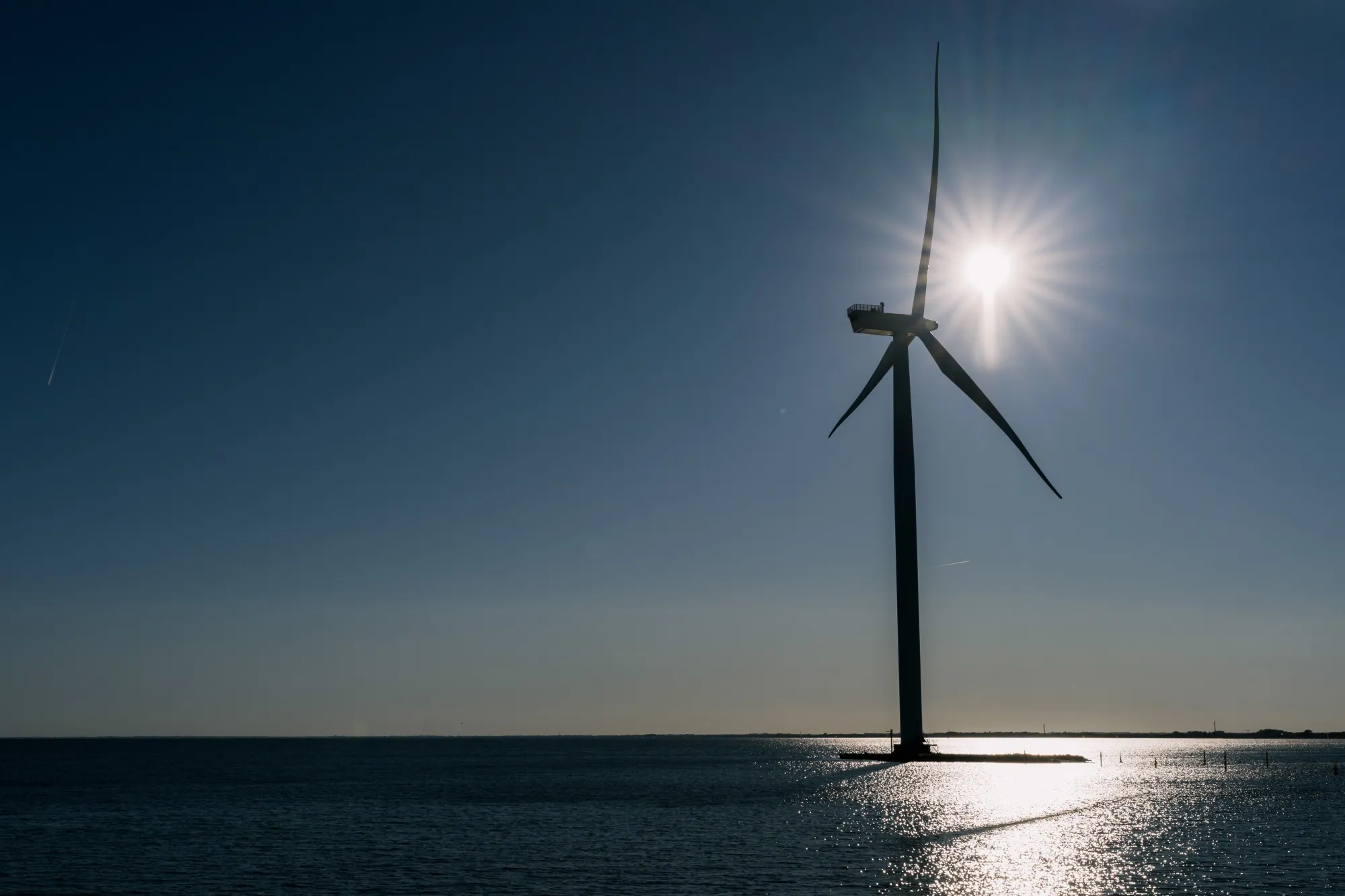 A wind turbine near the Avedore power station, operated by Orsted A/S, near Copenhagen, Denmark.