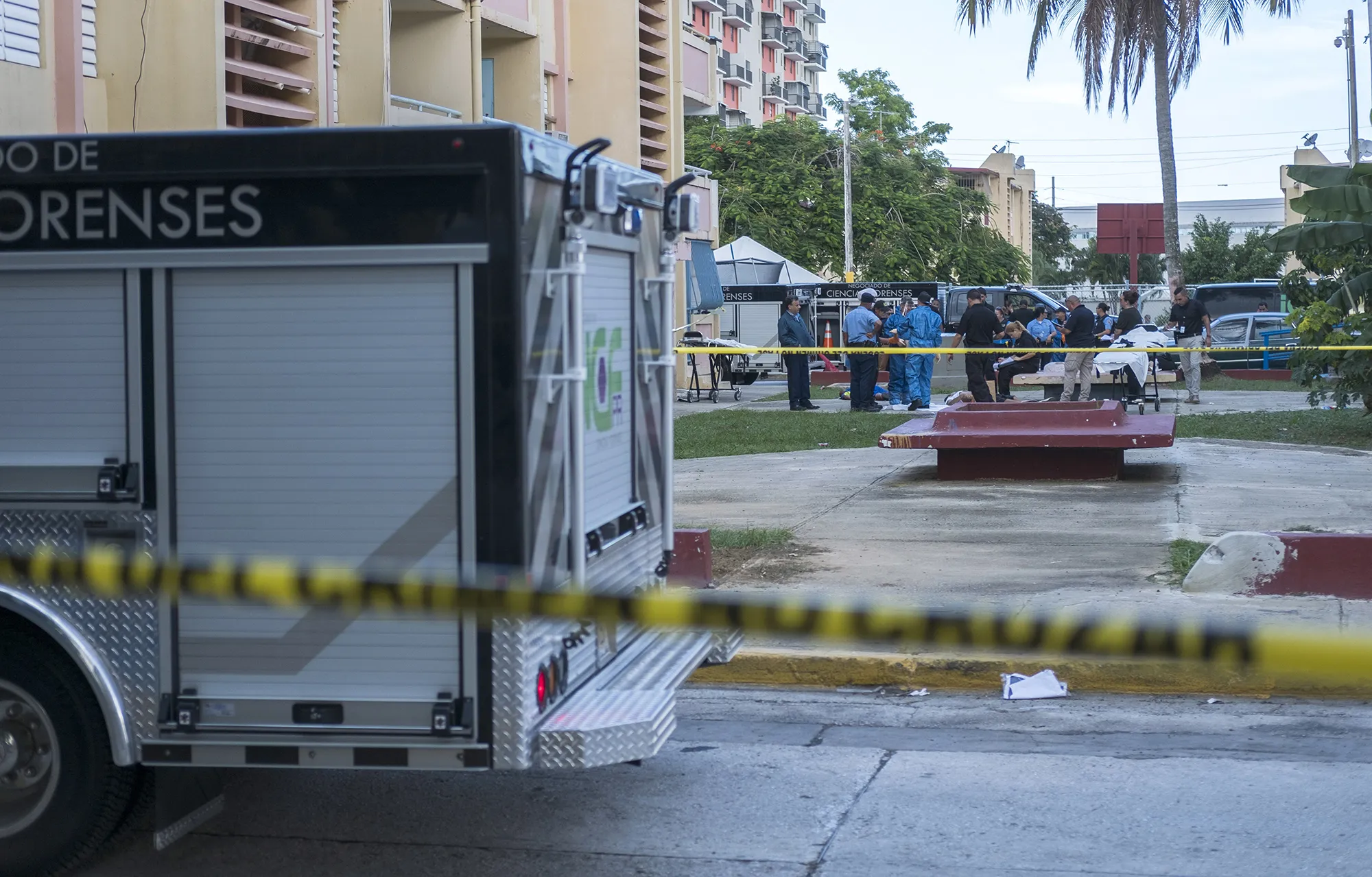 Police investigators work the scene of a multiple killing in San Juan, Puerto Rico, Tuesday, Oct. 15.