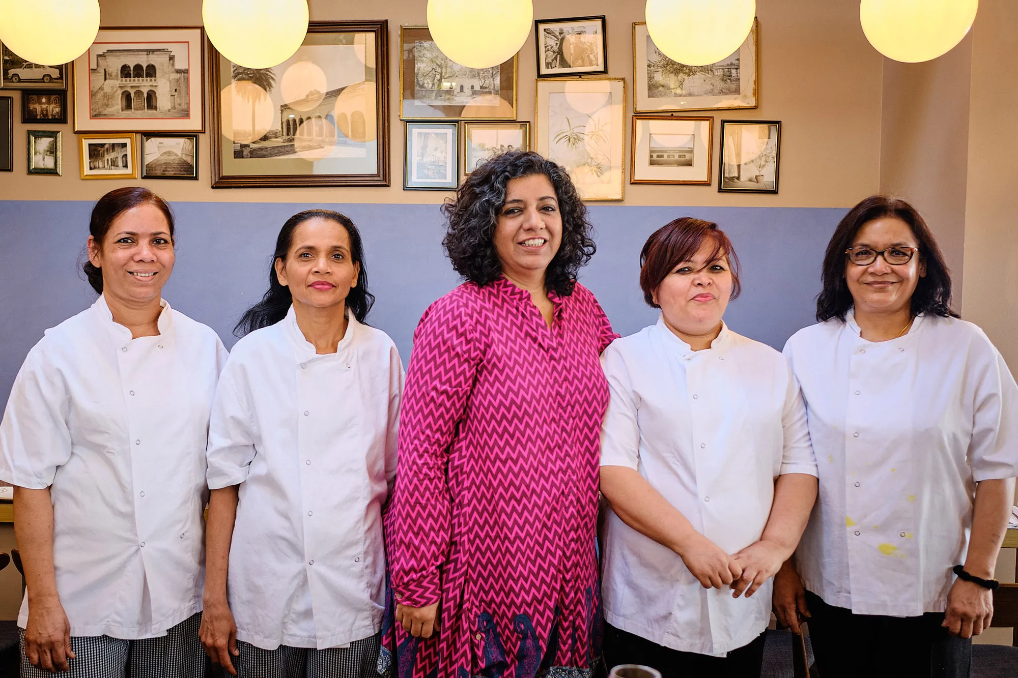 Asma Khan, center, and her team, prior to&nbsp;the coronavirus lockdown.
