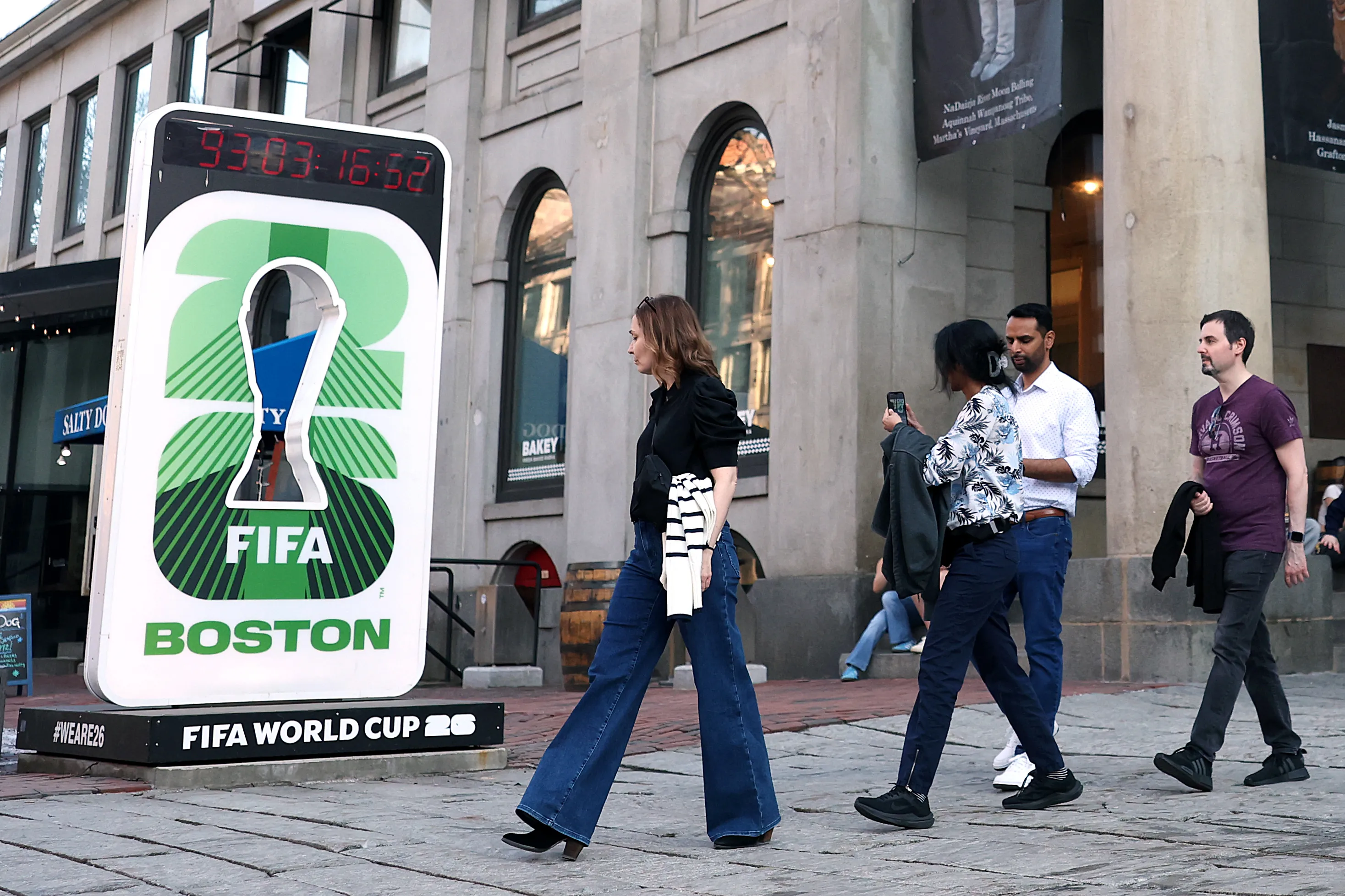 Office workers finding out for the first time about the FIFA World Cup 2026 outside Faneuil Hall Marketplace in Boston on March 10.