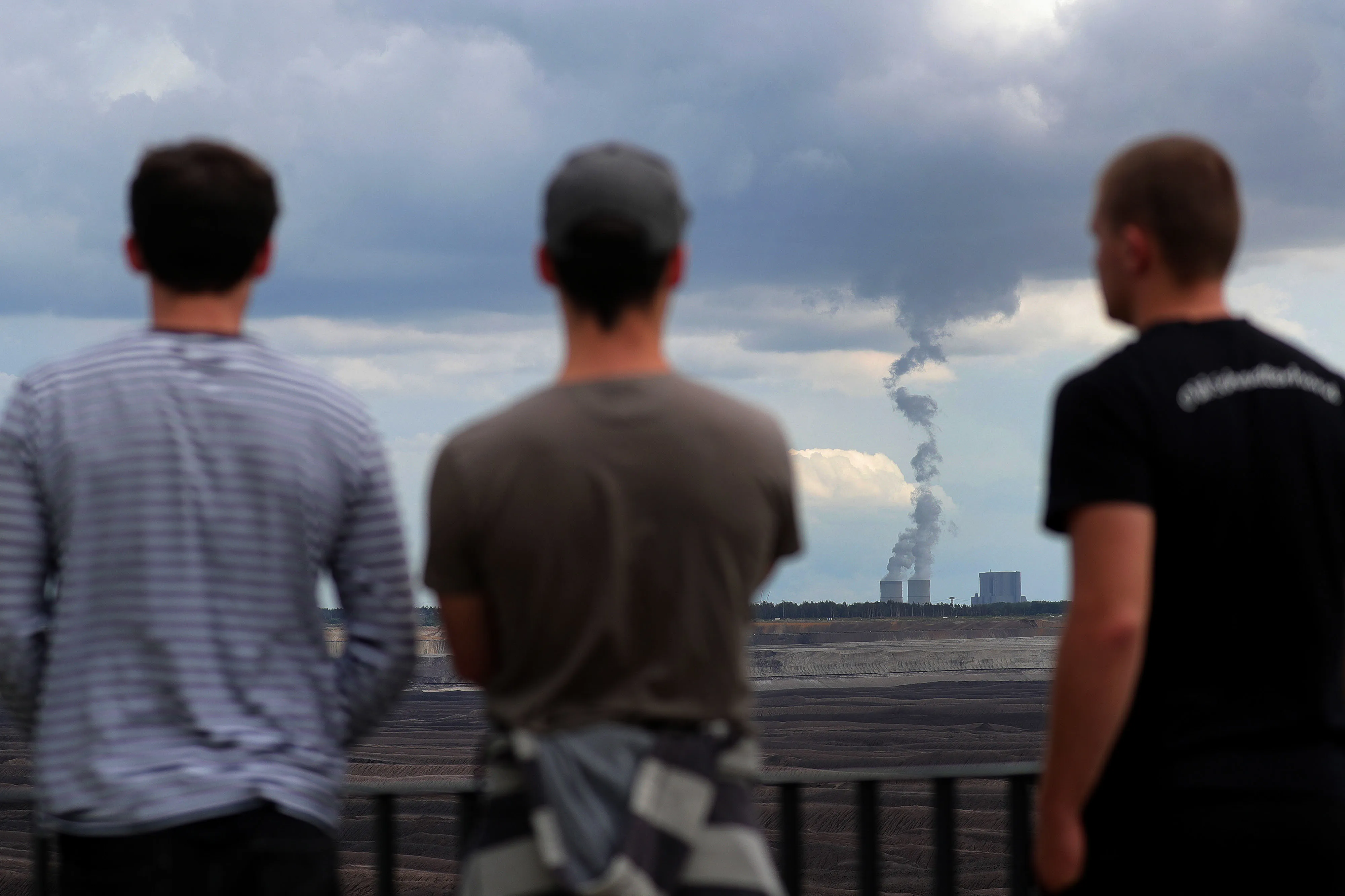 Visitors look towards the&nbsp;cooling towers at coal fueled power plant&nbsp;in Welzow, Germany.