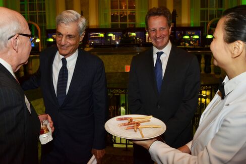 Robert Rubin and Tim Geithner flank an offering of Cipriani breadsticks wrapped in prosciutto.