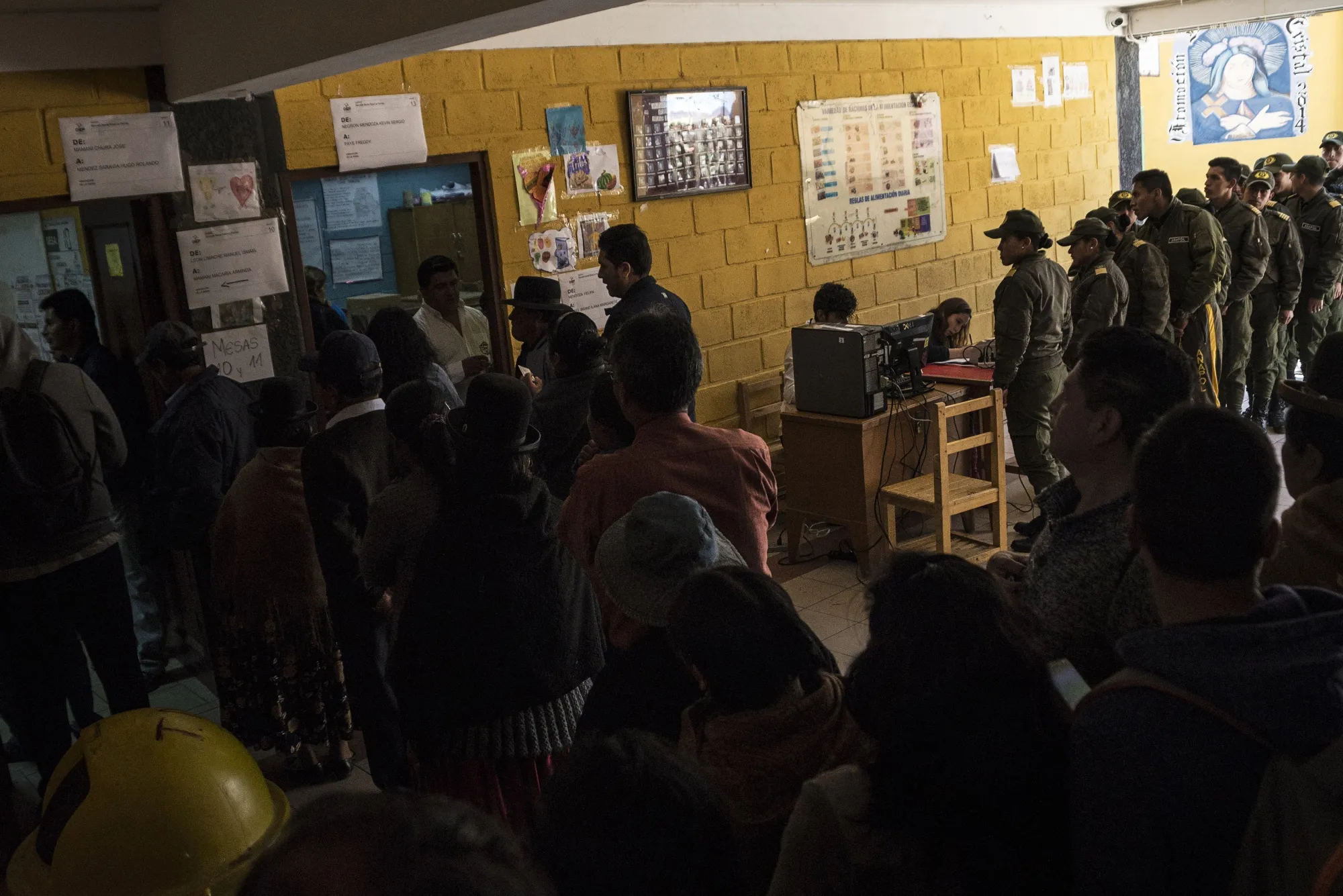 Bolivians line up to cast their vote at a polling station in La Paz on Oct. 20.