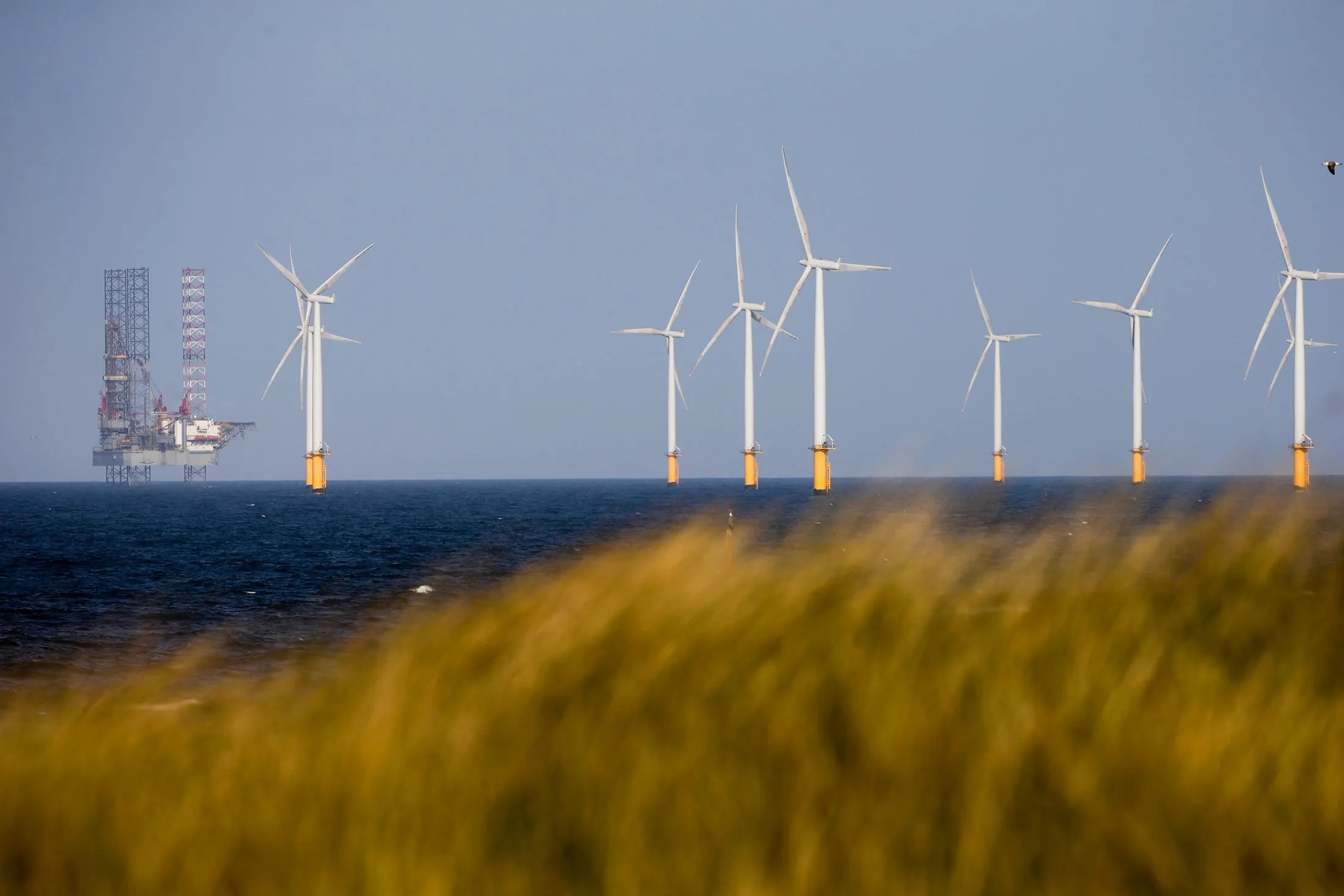 A jack-up rig stands near to Teesside Offshore Wind Farm, operated by EDF Energy Renewables Ltd., in Hartlepool, U.K., on Wednesday, May 3, 2017. The wind farm has a capacity of 62.1 megawatts.
