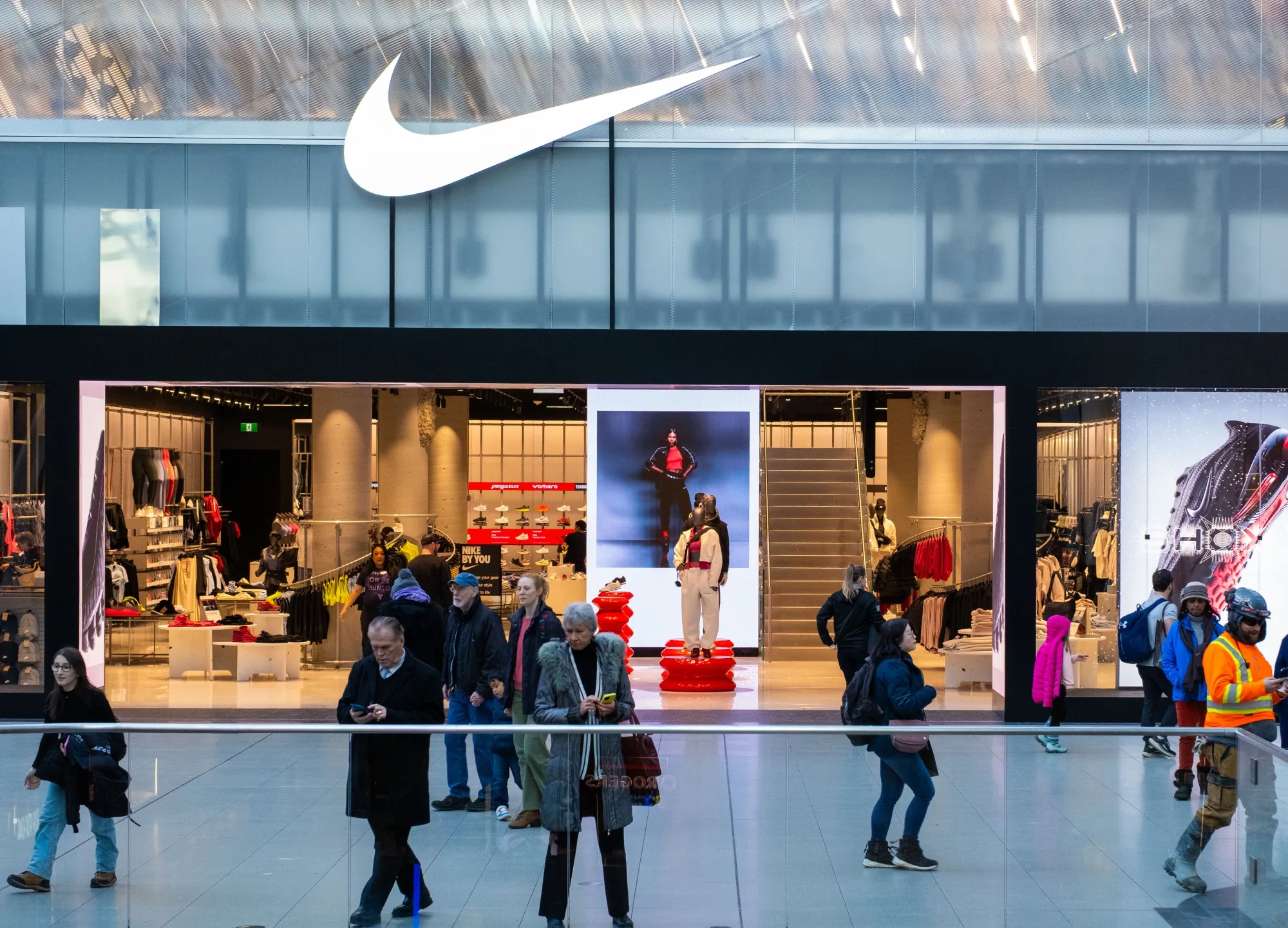 Shoppers outside a Nike store.&nbsp;