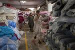 Workers at warehouse of a textile manufacturer in Karachi, Pakistan.