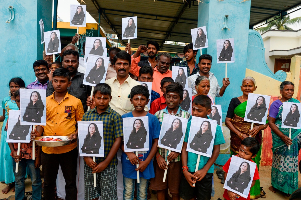 Villagers hold photos of U.S. Vice President-elect Kamala Harris in Thulasendrapuram, India, on Jan. 20.