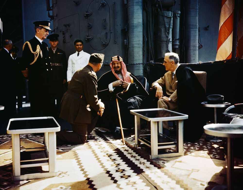King Abdul Aziz bin Abdul Rahman Al Saud (Ibn Saud) of Saudi Arabia in conference with President Franklin Delano Roosevelt aboard the USS Quincy, February 14, 1945.