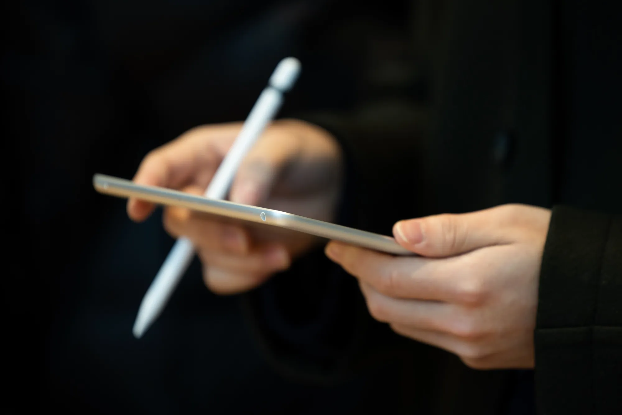 A person uses a tablet.