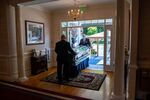 A coffin is brought outside the Clayton and McGirr Funeral Home for a drive-by viewing in Freehold, New Jersey, on June 09.