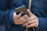 A customer views an Apple iPhone X.