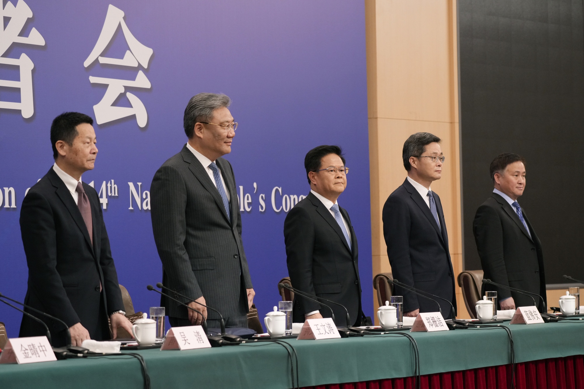 Wu Qing, chairman of the CSRC, from left, Wang Wentao, China's commerce minister, Zheng Shanjie, chairman of the&nbsp;NDRC, Lan Fo'an, China's finance minister, and Pan Gongsheng, governor of the PBOC,&nbsp;in Beijing on March 6.