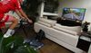 A cyclist uses Zwift in her living room in Melbourne, Australia.