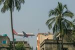 An Air India Ltd. aircraft prepares to land at Netaji Subhas Chandra Bose International Airport in Kolkata, India.