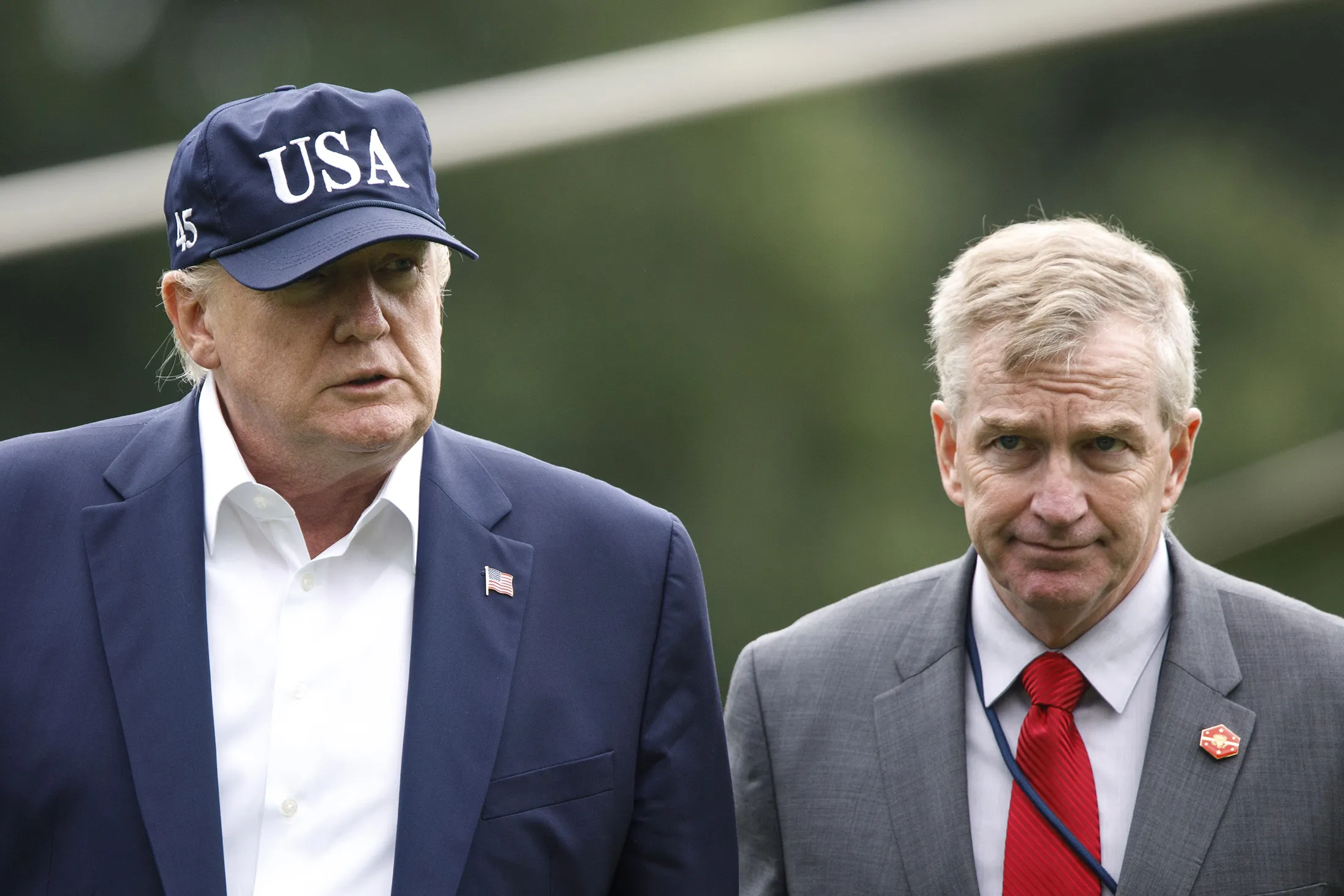 President Trump walks with Rear&nbsp;Adrimal Peter Brown on Sept 1.