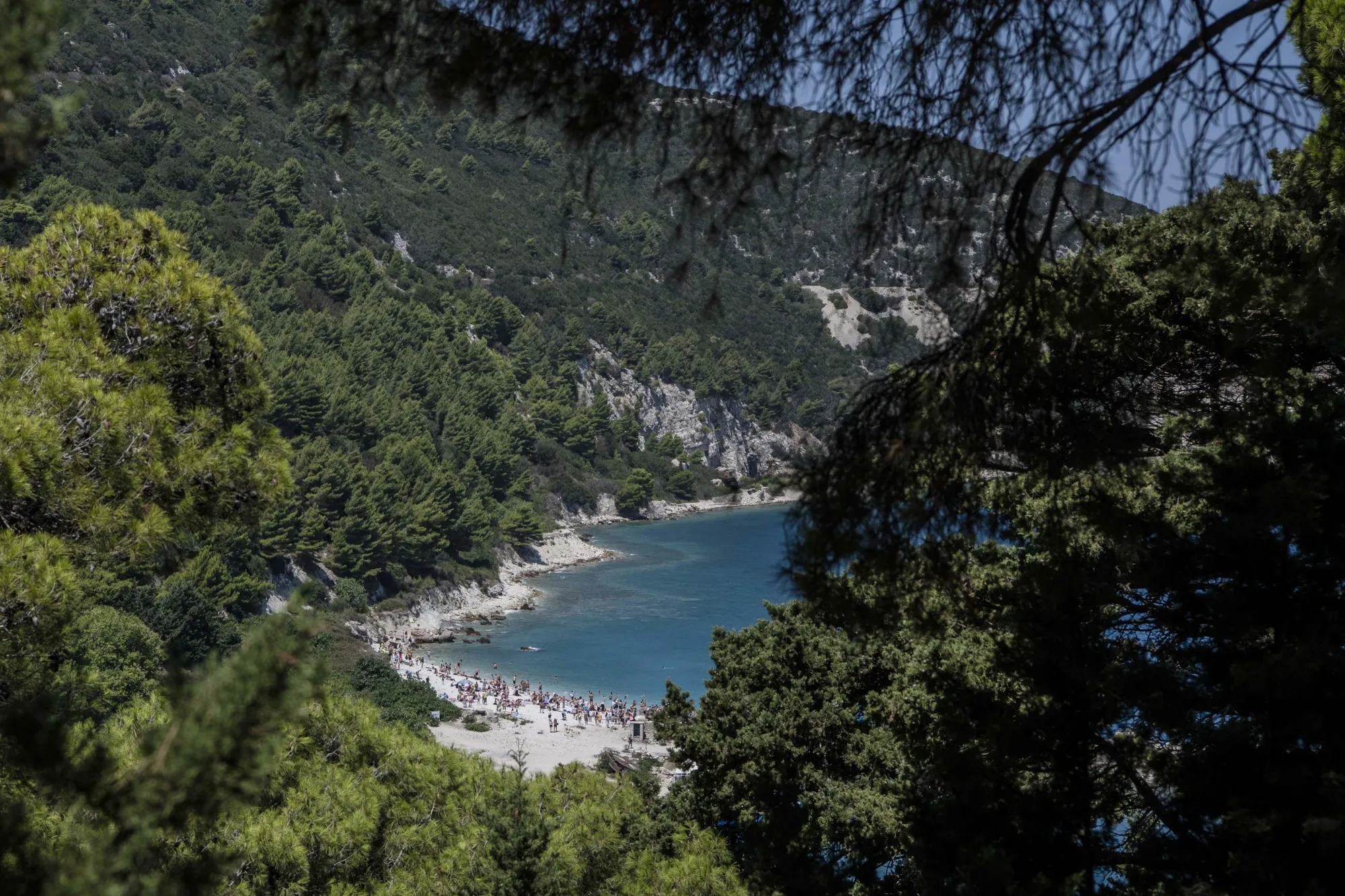 Visitors at the beach on Sazan island, Albania, in 2024. 