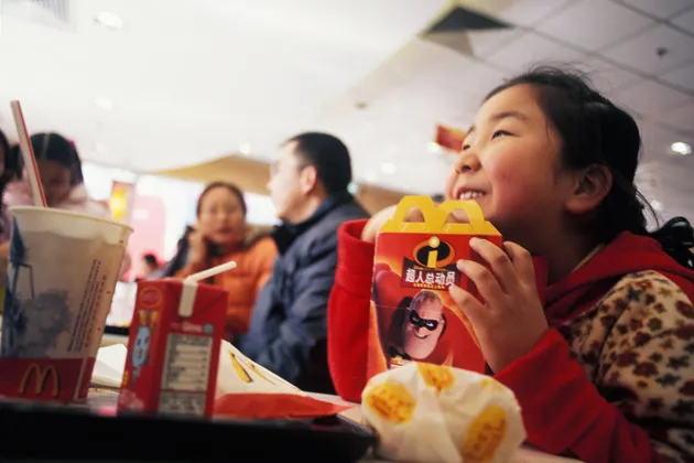 Children eating Happy Meals at a Beijing McDonalds
